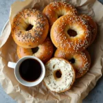 Close-up of hot bagels with cream cheese and coffee, perfect for breakfast